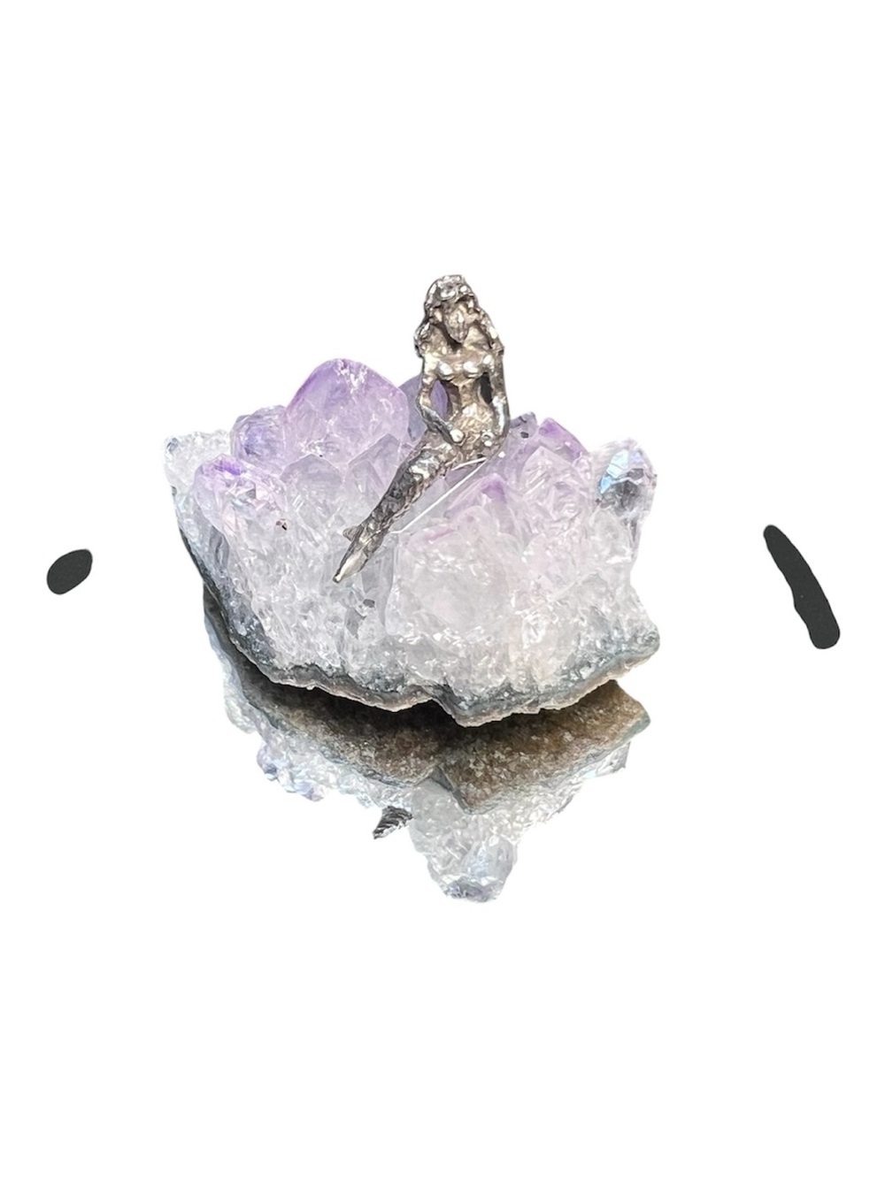 Silver Mermaid made of Pewter. Sitting on a Quartz Crystal.